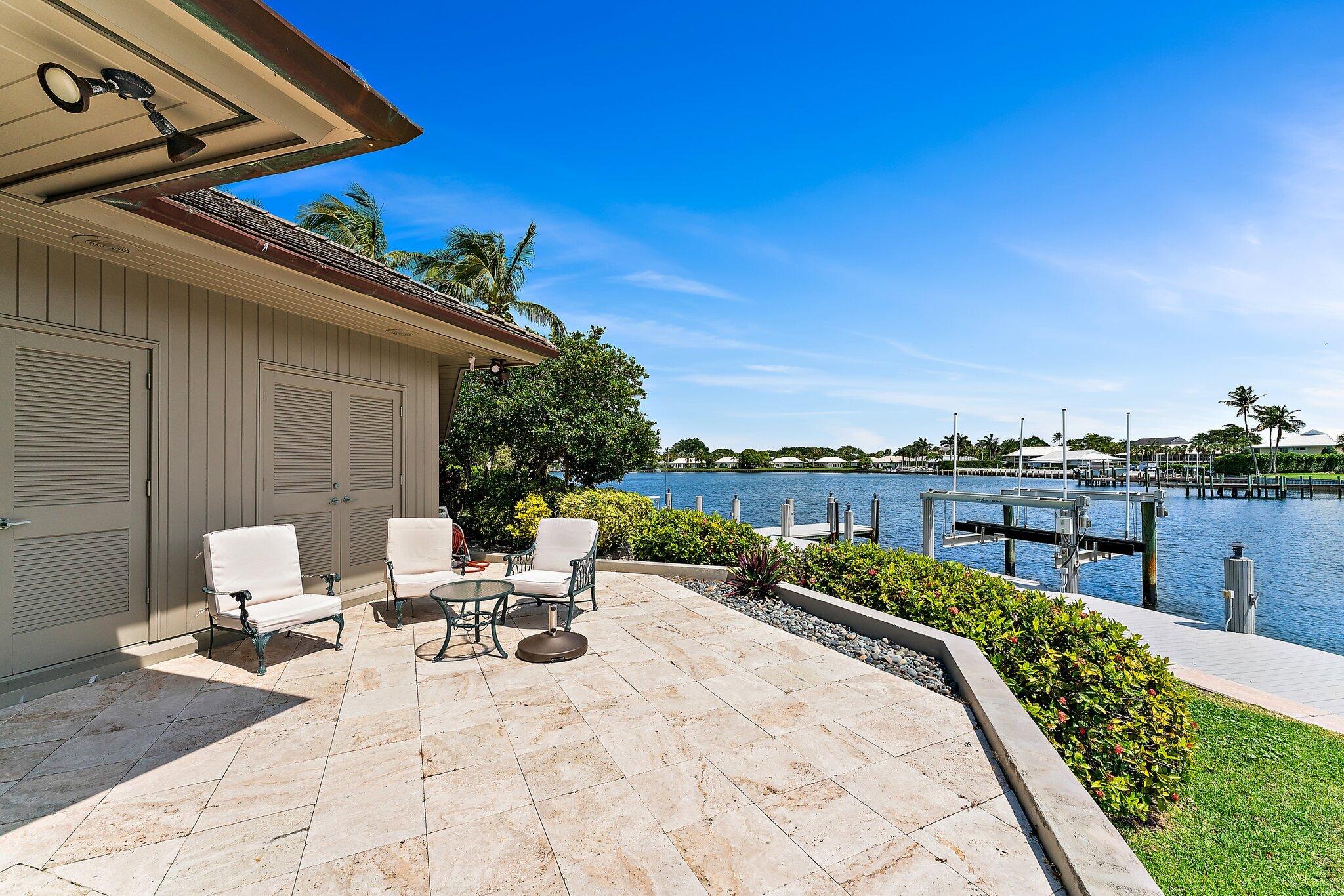 1454 Point Way North Palm Beach, FL 33408 - Photo 42 of 47 a view of a patio with a table and chairs