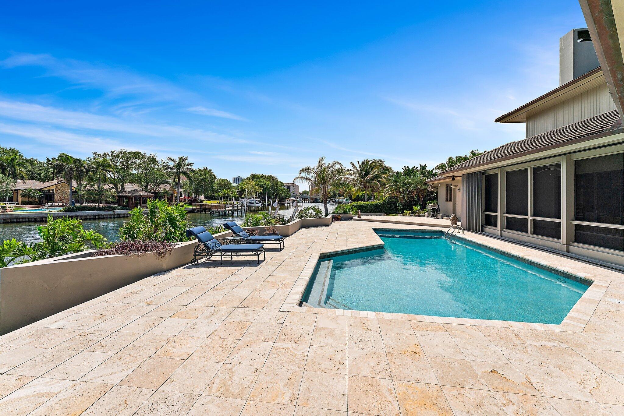 1454 Point Way North Palm Beach, FL 33408 - Photo 43 of 47 a view of a swimming pool with a lounge chair