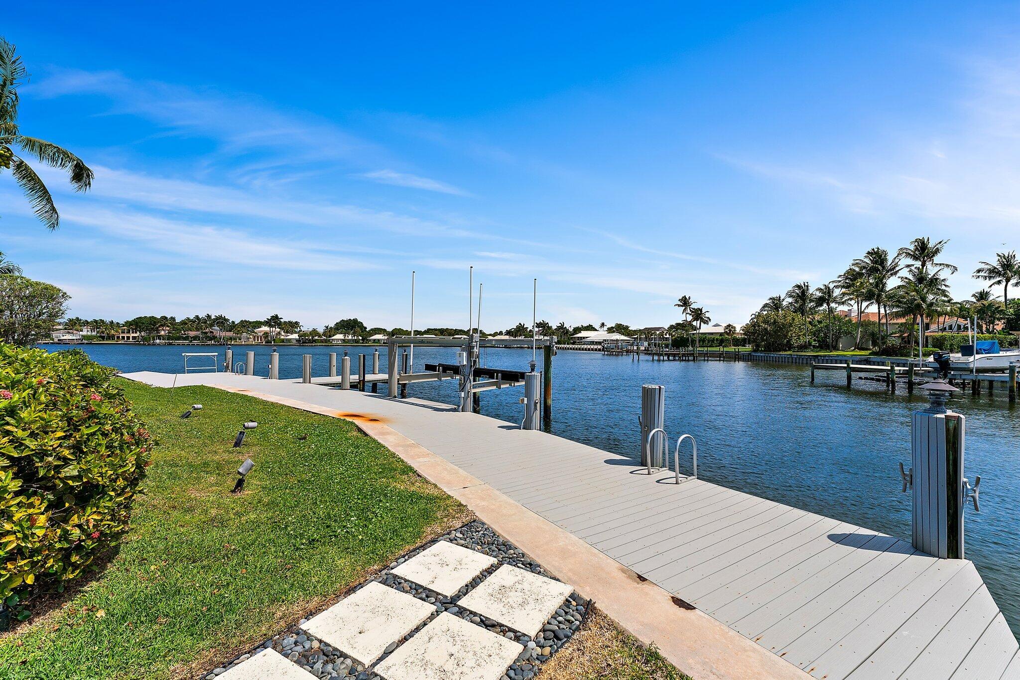 1454 Point Way North Palm Beach, FL 33408 - Photo 44 of 47 a view of a lake with a yard