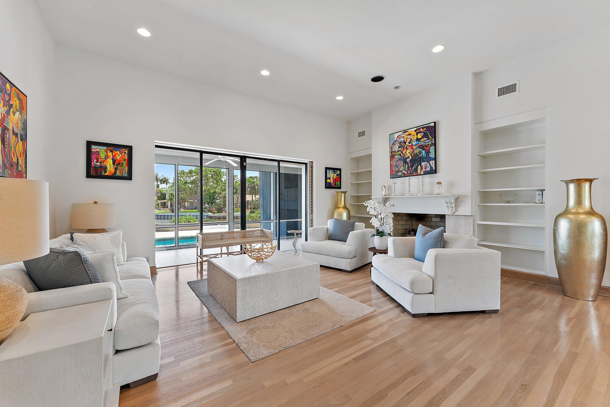 1454 Point Way North Palm Beach, FL 33408 - Photo 7 of 47 a living room with fireplace furniture and a large window