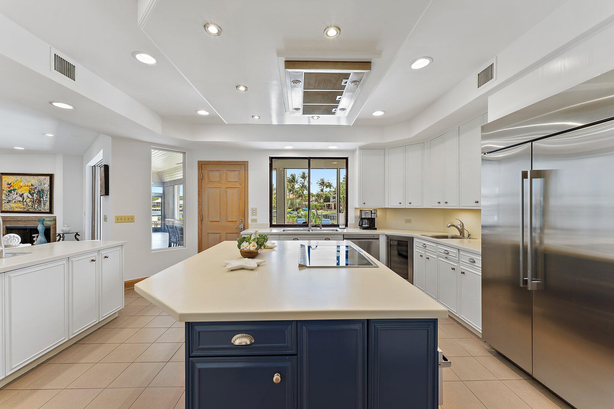 1454 Point Way North Palm Beach, FL 33408 - Photo 9 of 47 a kitchen with a sink a counter top stainless steel appliances and cabinets