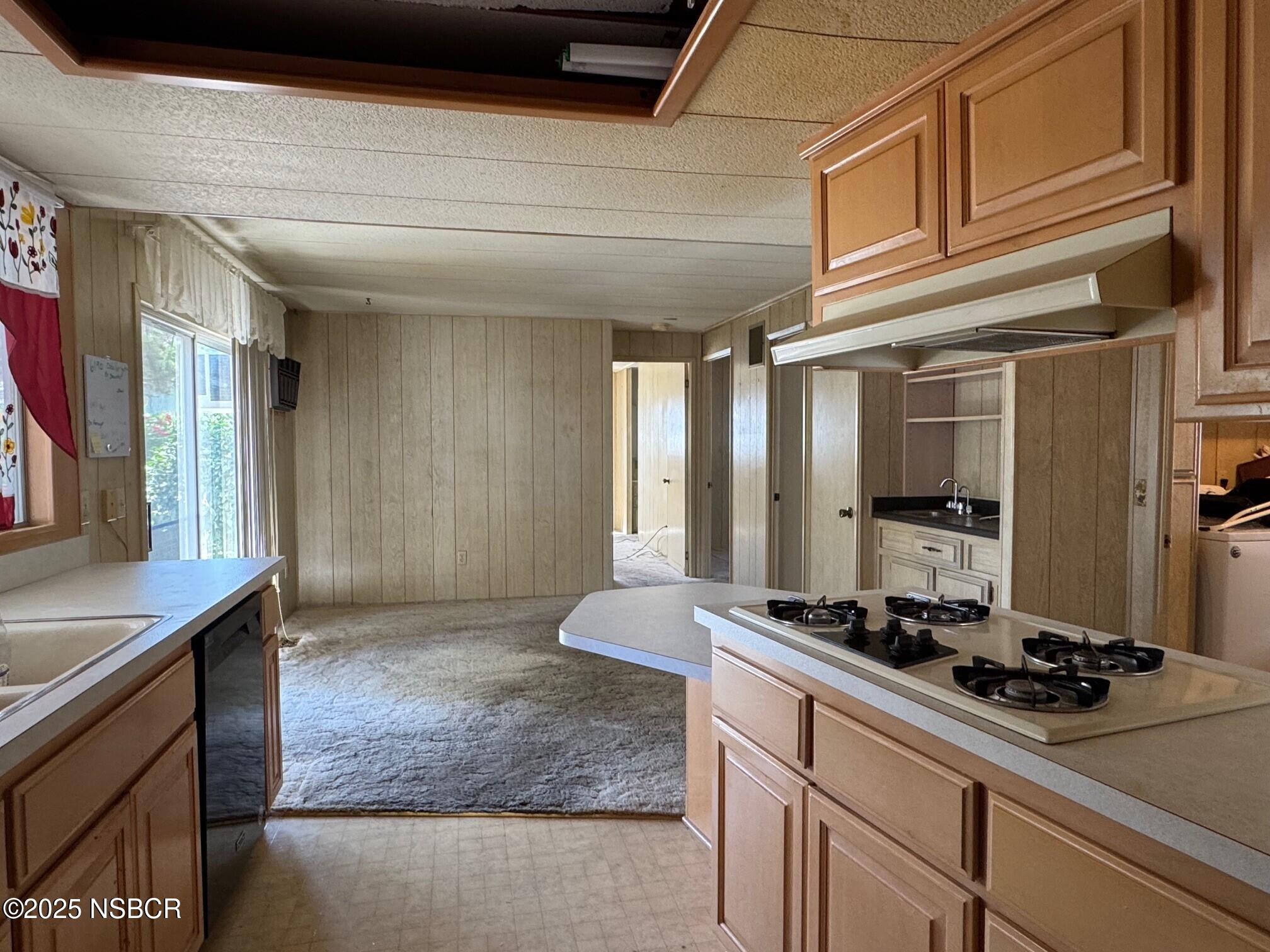 22 Via Del Sol Solvang, CA 93463 - Photo 10 of 16 a kitchen with stainless steel appliances granite countertop a sink stove and cabinets