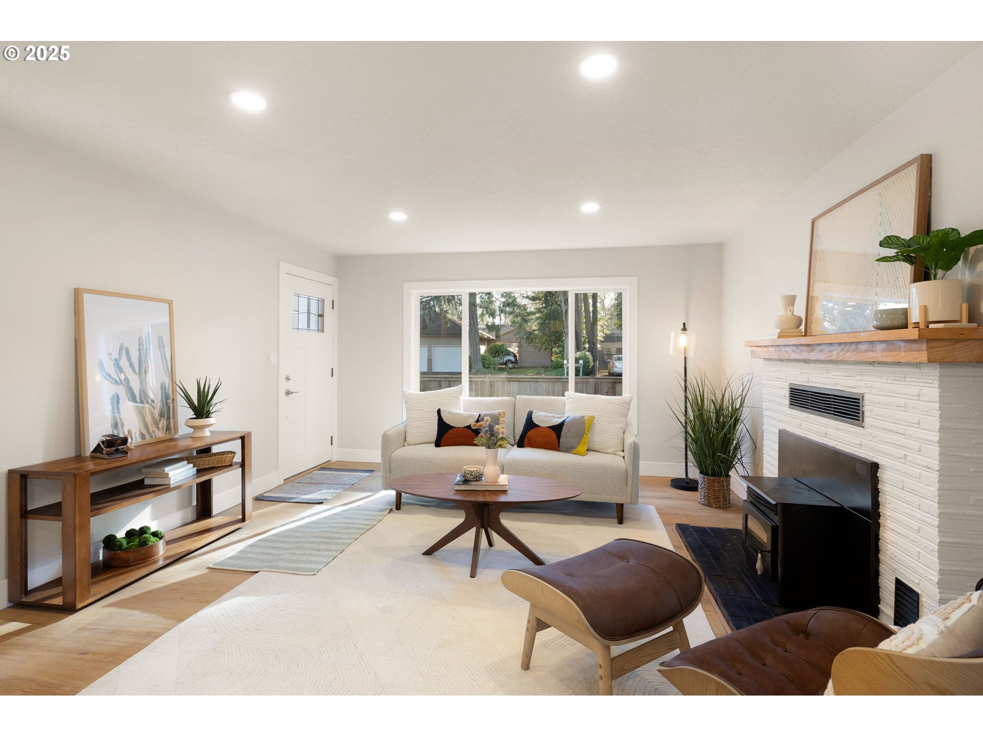1489 Cal Young Road Eugene, OR 97401 - Photo 15 of 47 a living room with furniture a fireplace and a flat screen tv
