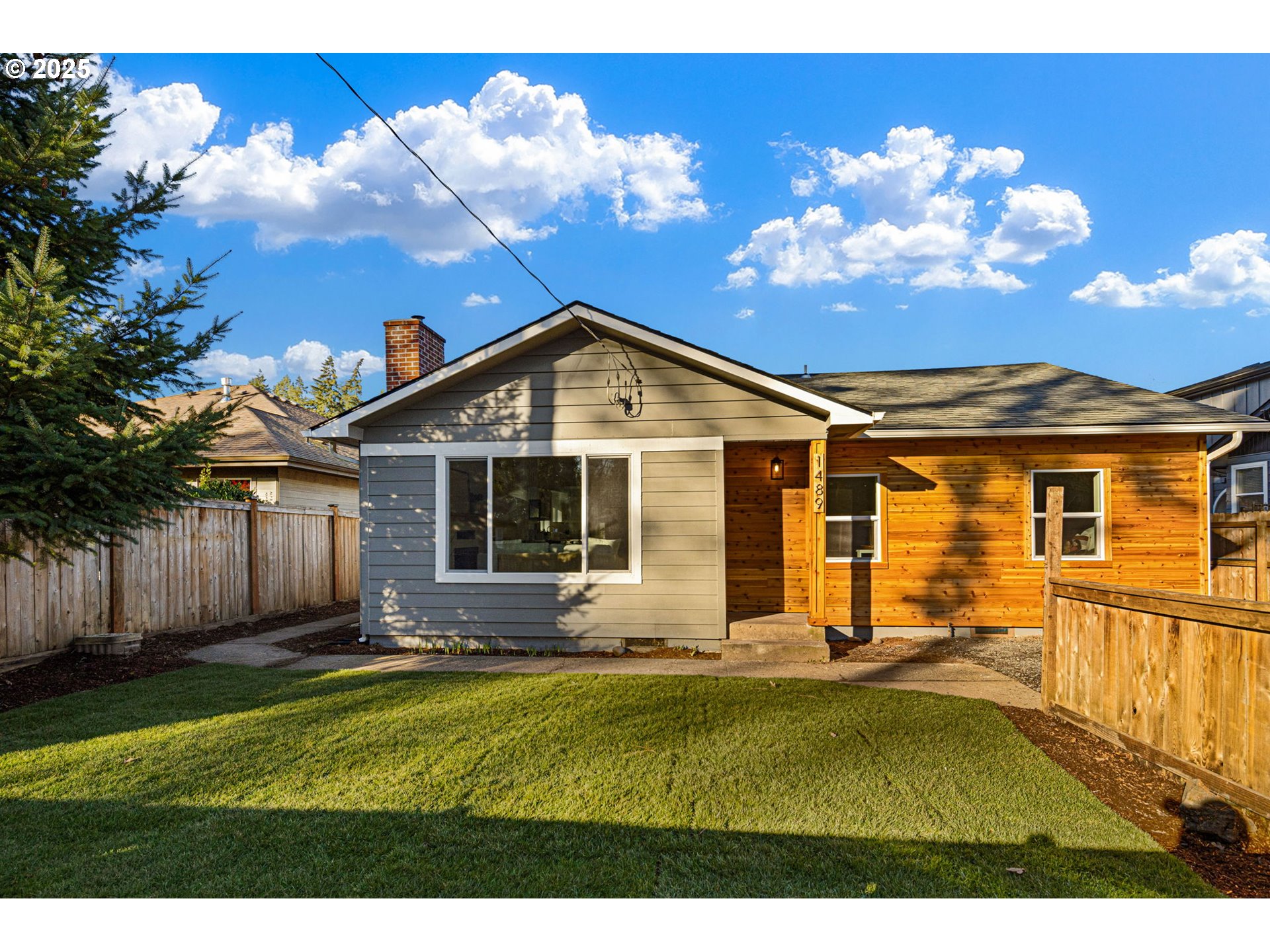 1489 Cal Young Road Eugene, OR 97401 - Photo 2 of 47 a front view of a house with garden