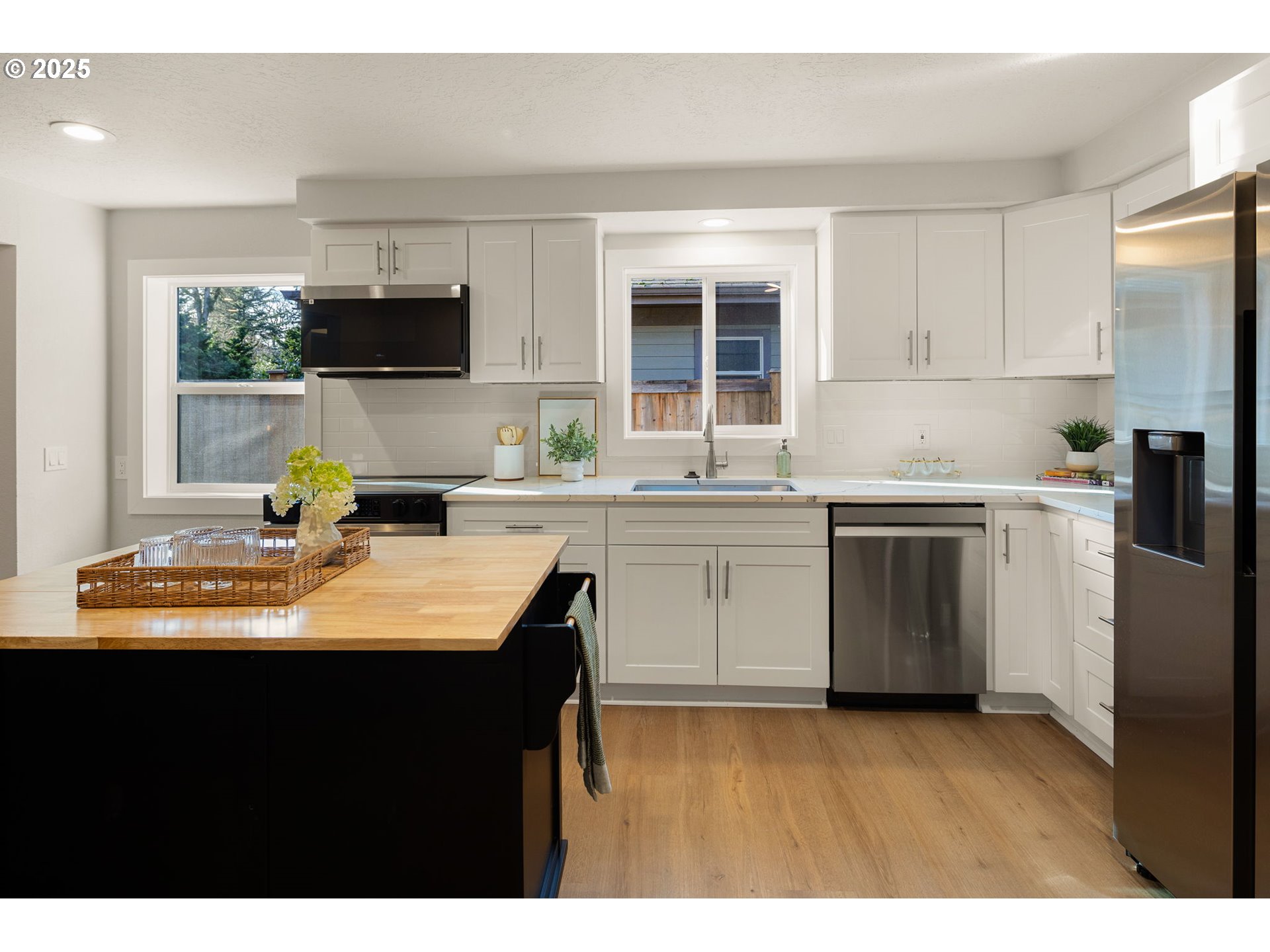 1489 Cal Young Road Eugene, OR 97401 - Photo 21 of 47 a kitchen with kitchen island a sink appliances and cabinets