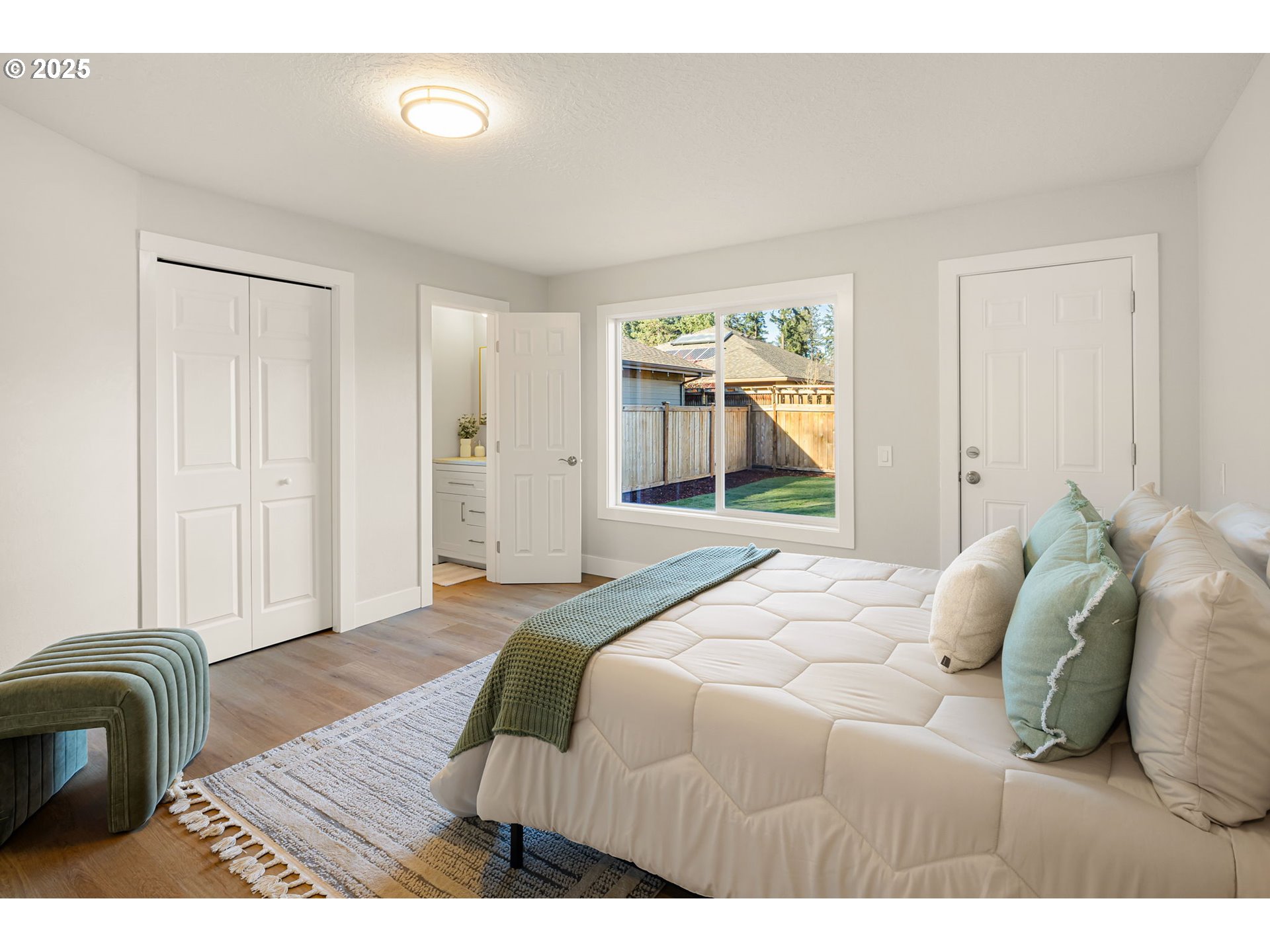 1489 Cal Young Road Eugene, OR 97401 - Photo 25 of 47 a bedroom with a bed and a large mirror