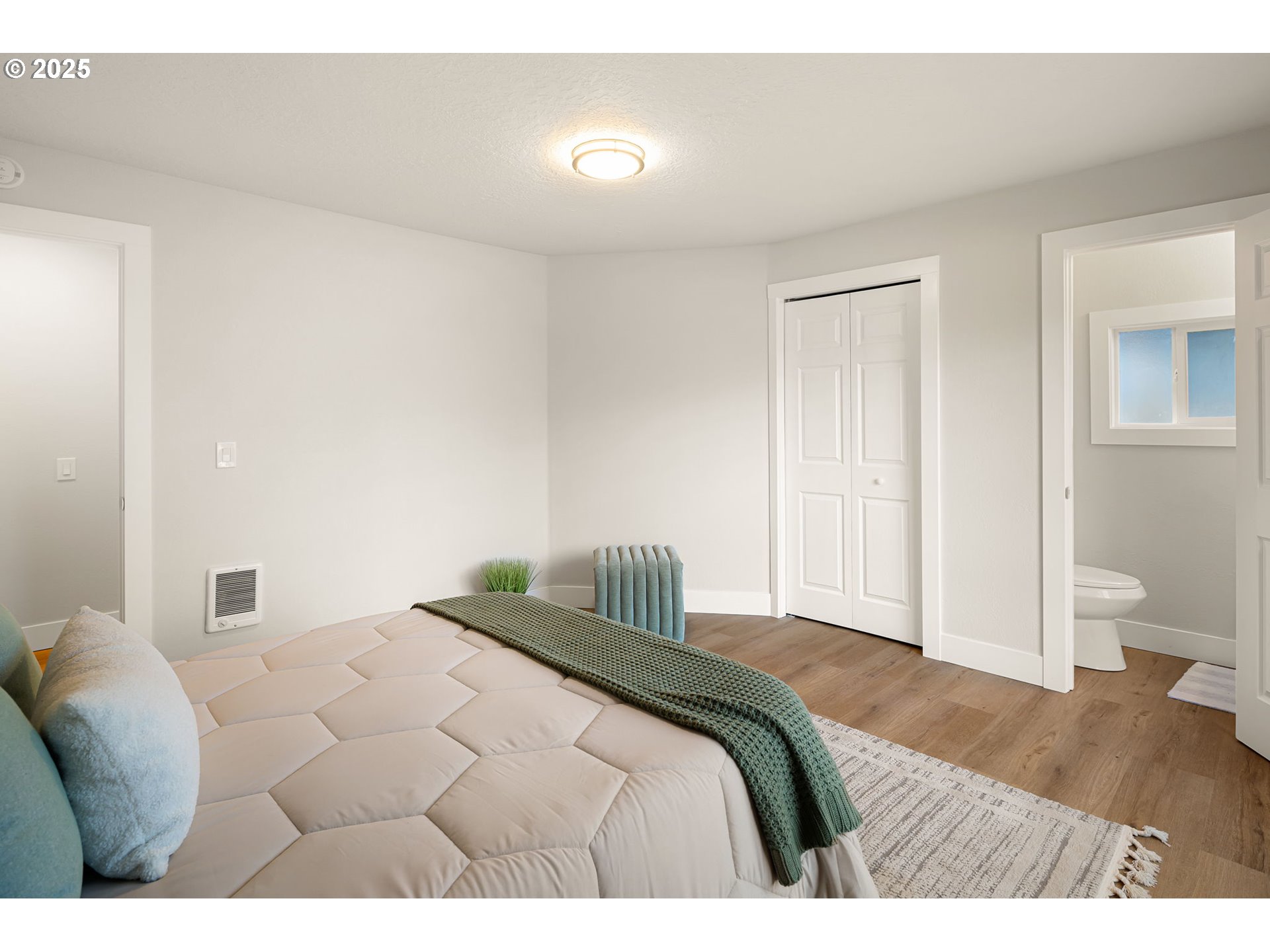 1489 Cal Young Road Eugene, OR 97401 - Photo 26 of 47 a bedroom with a bed and a lamp