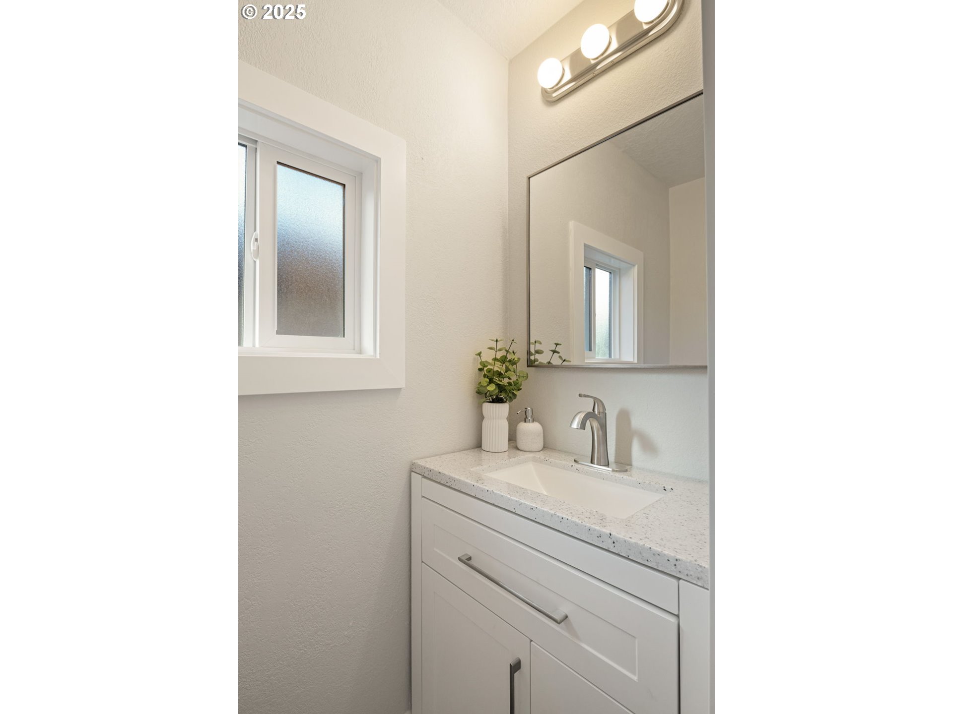 1489 Cal Young Road Eugene, OR 97401 - Photo 28 of 47 a bathroom with a sink and a mirror