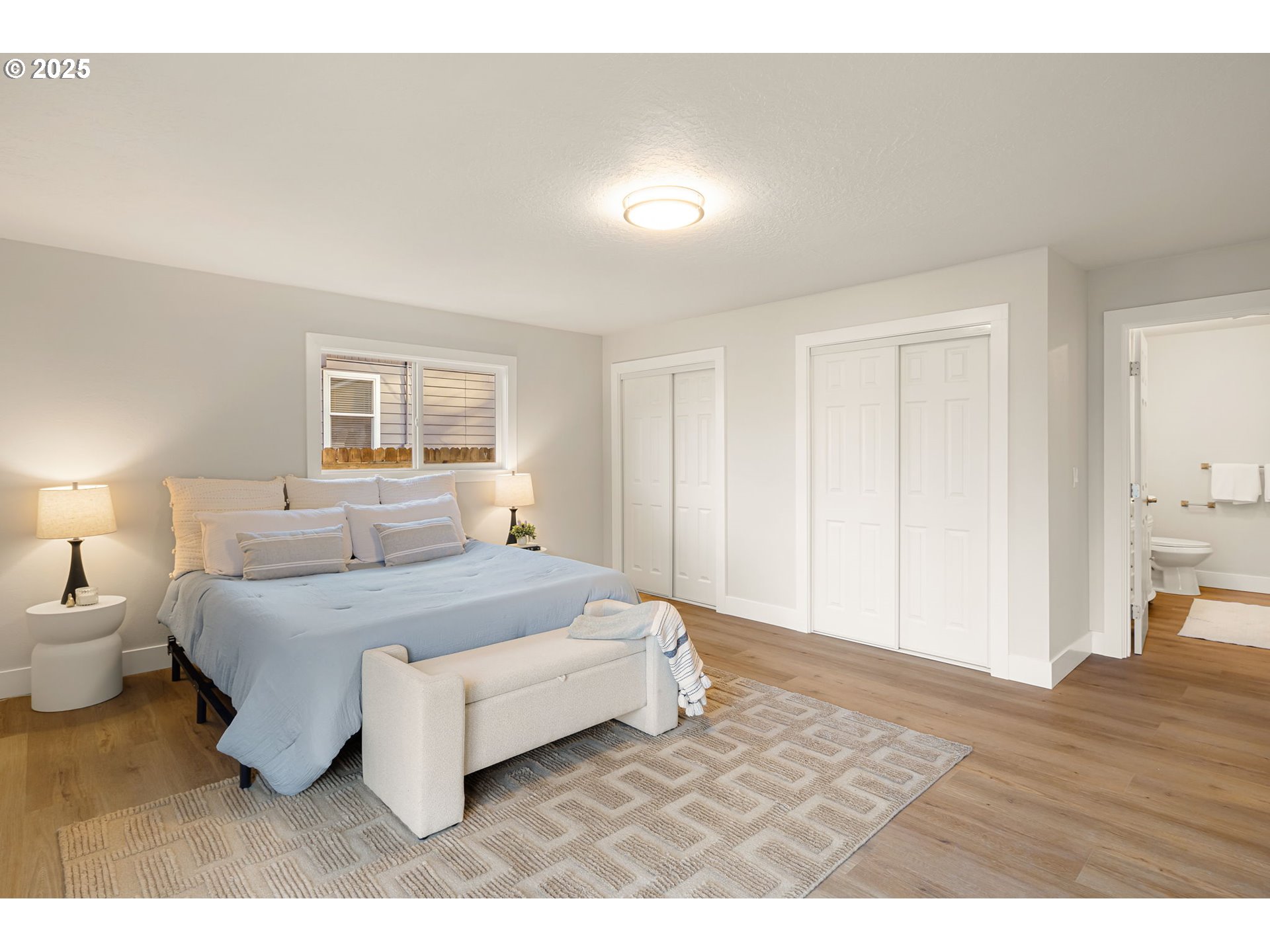 1489 Cal Young Road Eugene, OR 97401 - Photo 30 of 47 a bedroom with a bed and a night stand