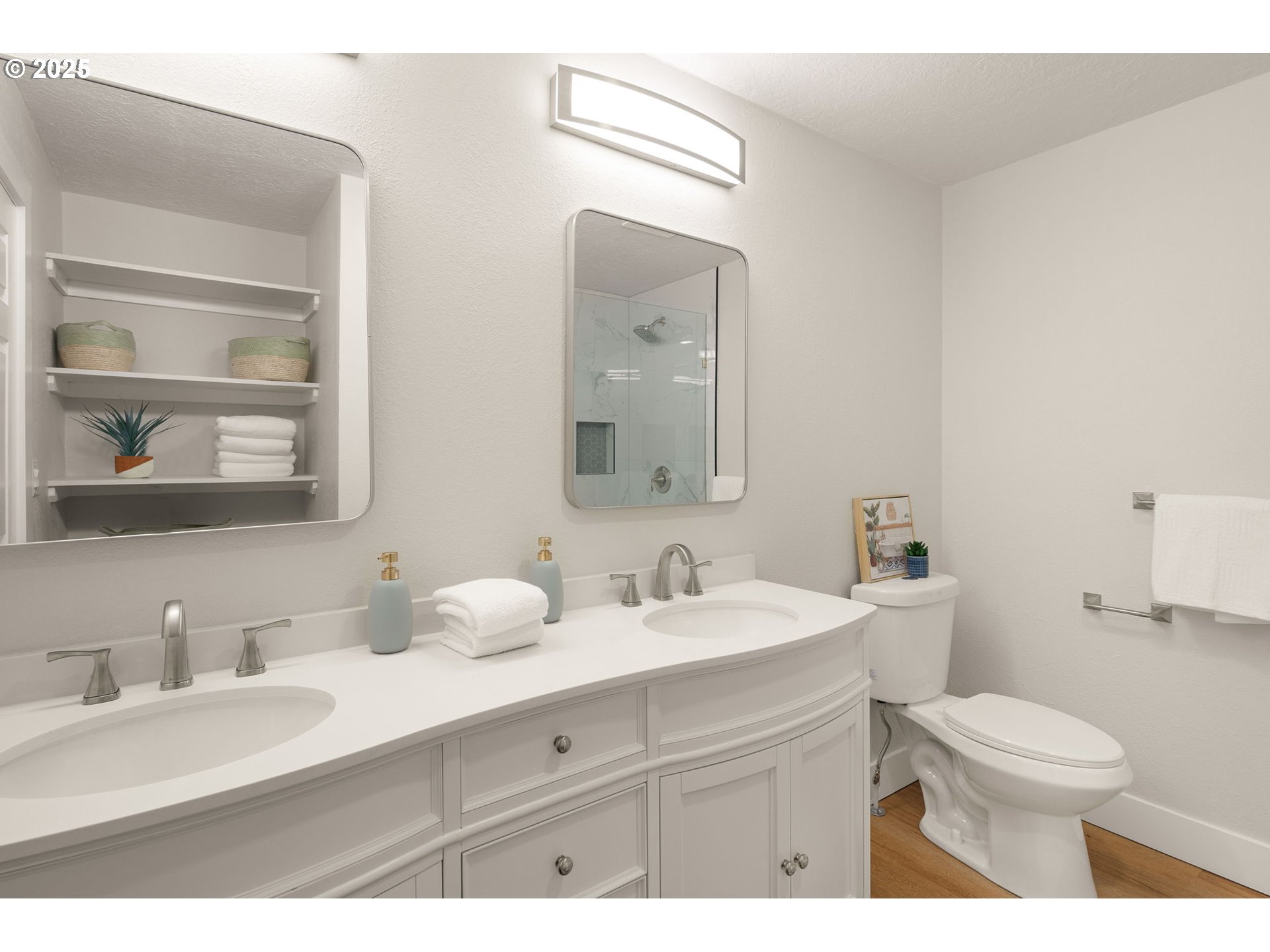 1489 Cal Young Road Eugene, OR 97401 - Photo 33 of 47 a bathroom with a toilet a sink a mirror and