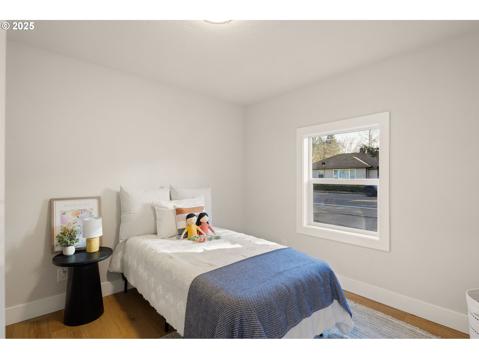 1489 Cal Young Road Eugene, OR 97401 - Photo 37 of 47 a bedroom with a bed and window