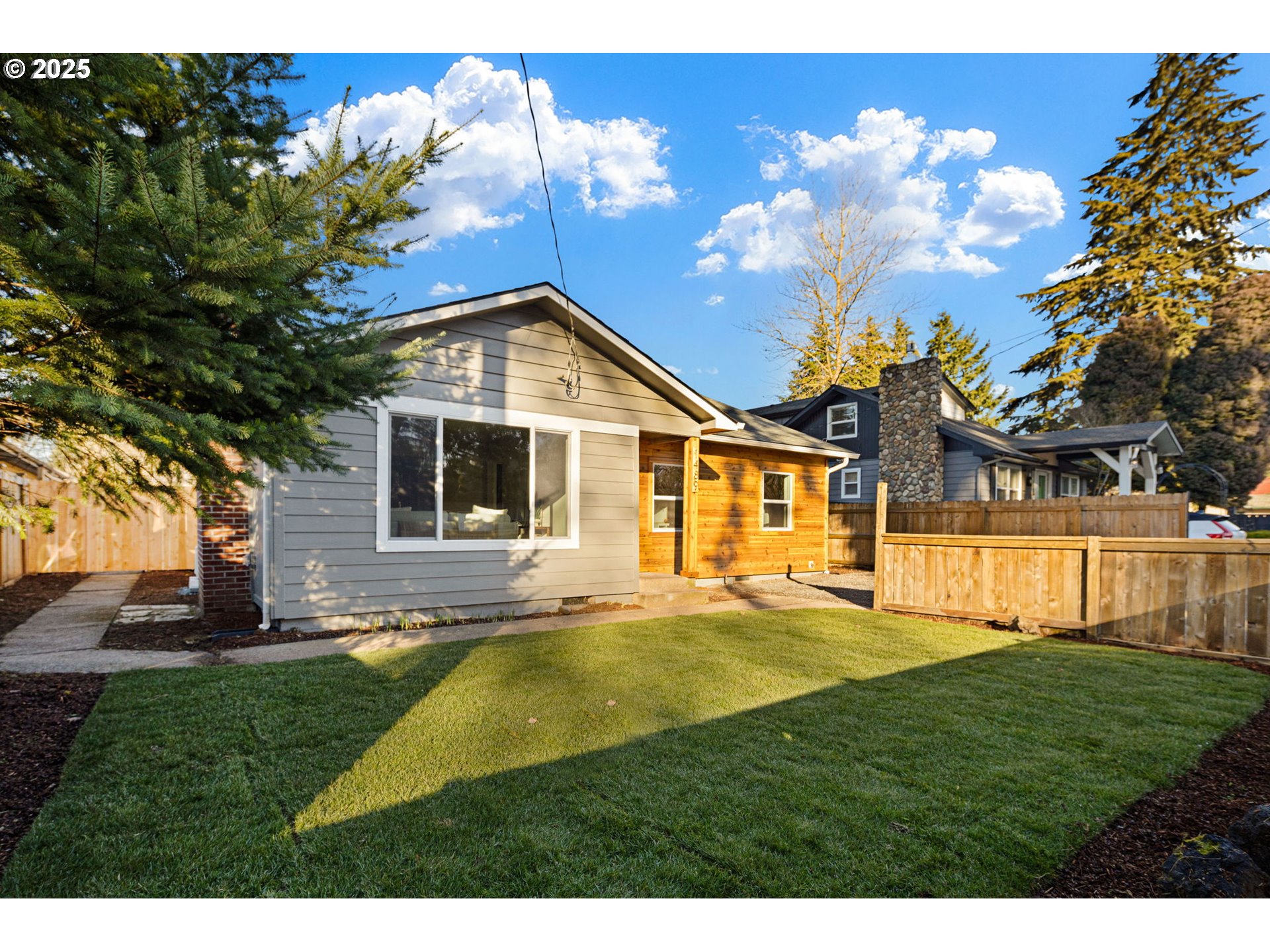 1489 Cal Young Road Eugene, OR 97401 - Photo 4 of 47 a front view of a house with a yard