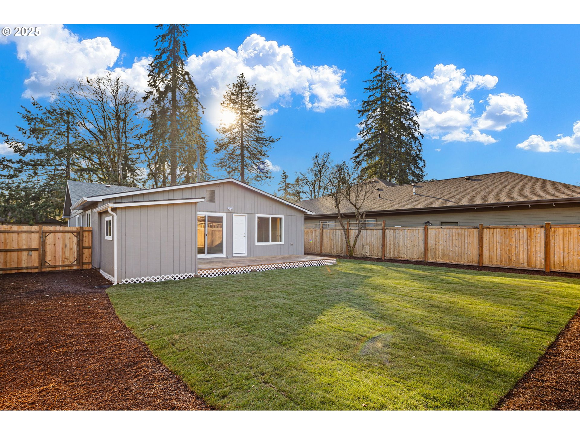 1489 Cal Young Road Eugene, OR 97401 - Photo 45 of 47 a white house with a big yard and large trees