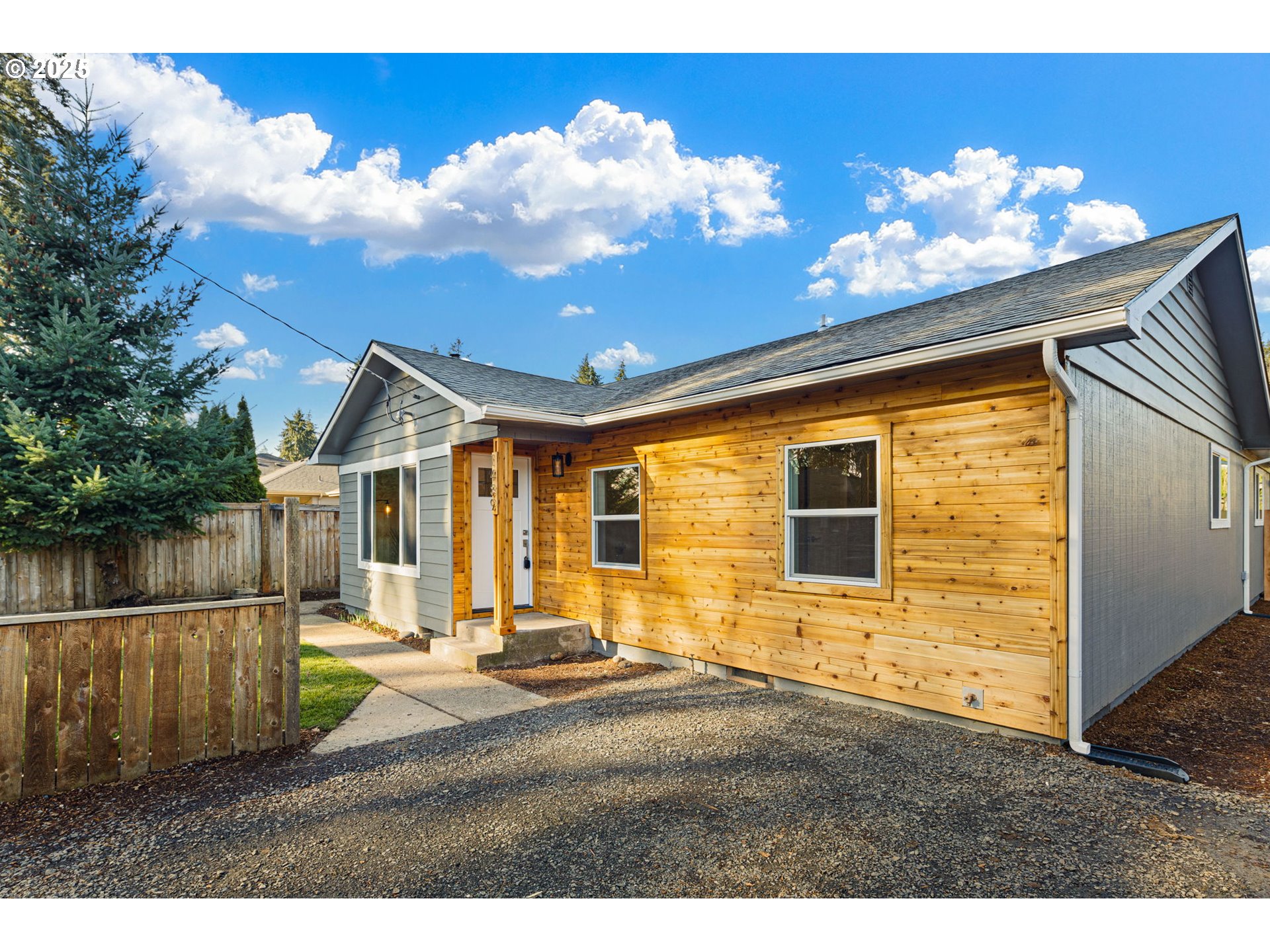 1489 Cal Young Road Eugene, OR 97401 - Photo 6 of 47 a view of a house with a small yard