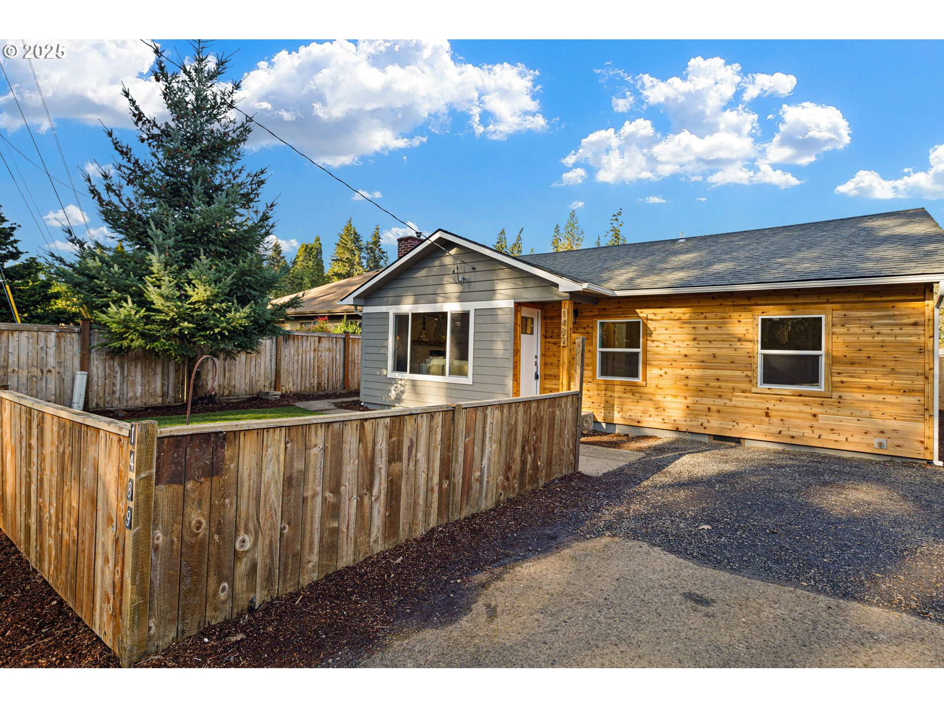 1489 Cal Young Road Eugene, OR 97401 - Photo 9 of 47 a view of a house with wooden fence