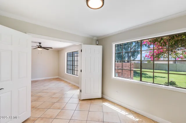 a view of an empty room with a window