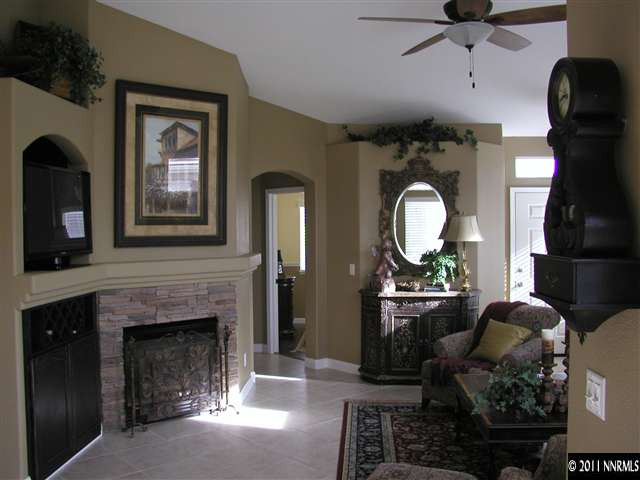 10585 Arbor Way Reno, NV 89521 - Photo 5 of 13 a living room with furniture and a fireplace
