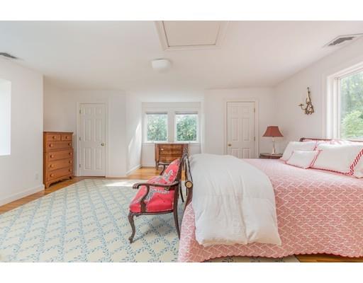 101 Hundreds Road Wellesley, MA 02481 - Photo 14 of 29 a bed room with a bed window and a chair