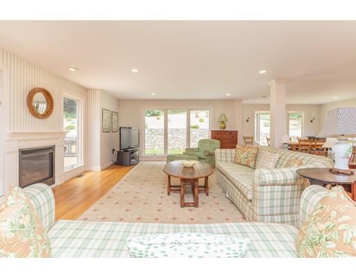 101 Hundreds Road Wellesley, MA 02481 - Photo 7 of 29 a living room with furniture a large window and a fireplace