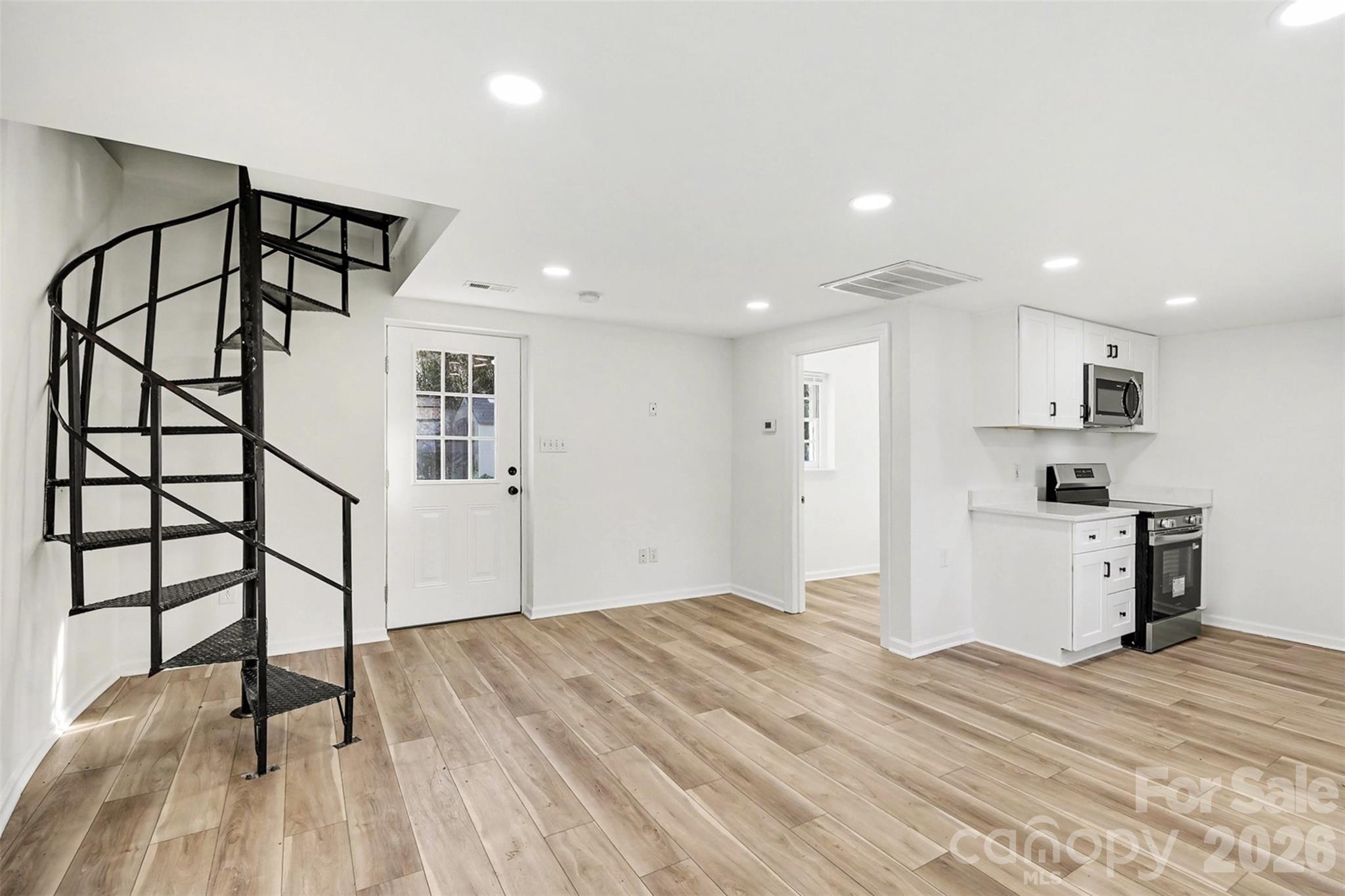 655 Ridgecrest Drive Mooresville, NC 28115 - Photo 13 of 16 a view of a kitchen with wooden floor and a sink