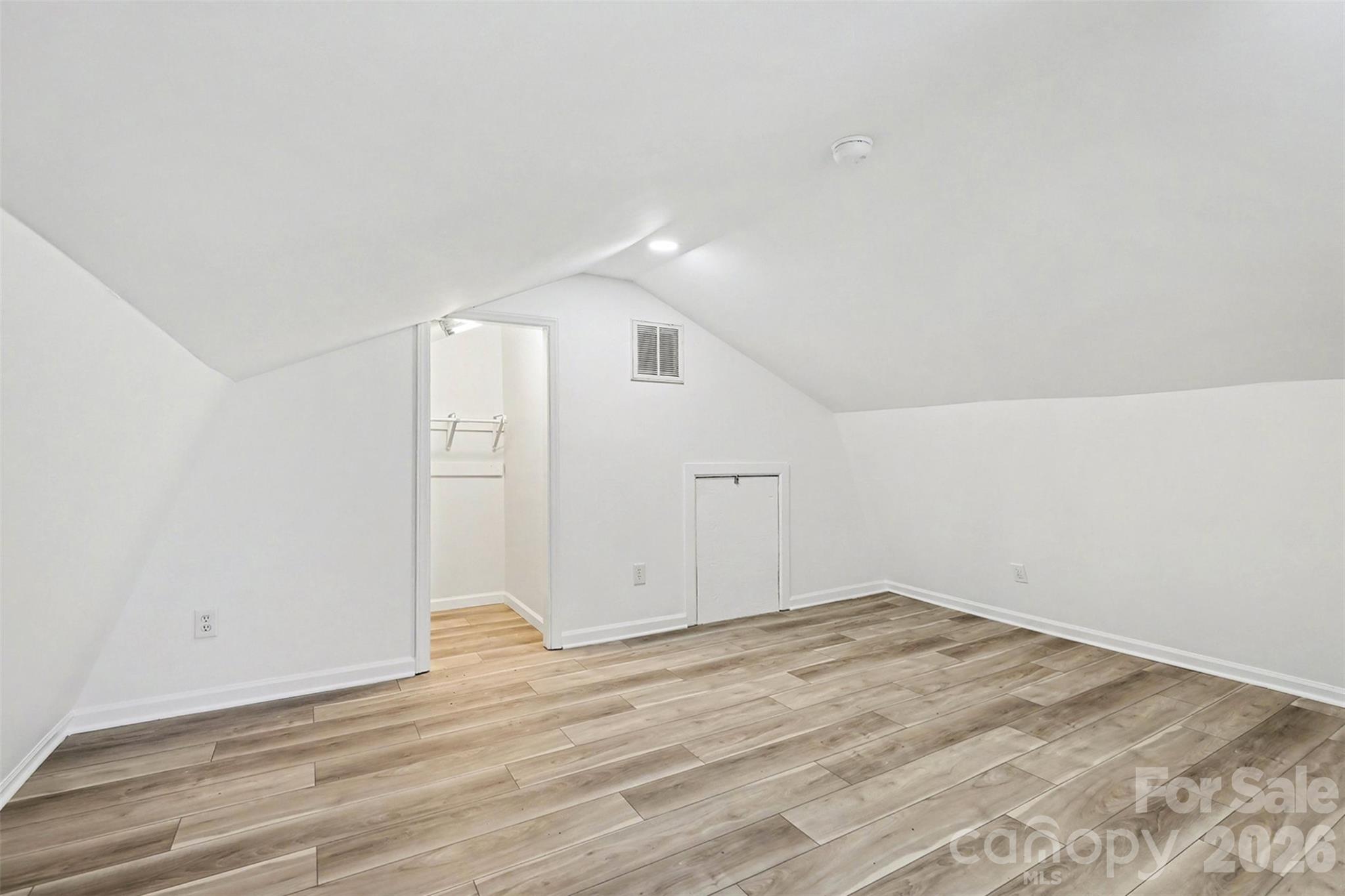 655 Ridgecrest Drive Mooresville, NC 28115 - Photo 5 of 16 an empty room with wooden floor and windows