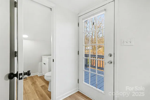 a view of a bathroom with a shower and a window