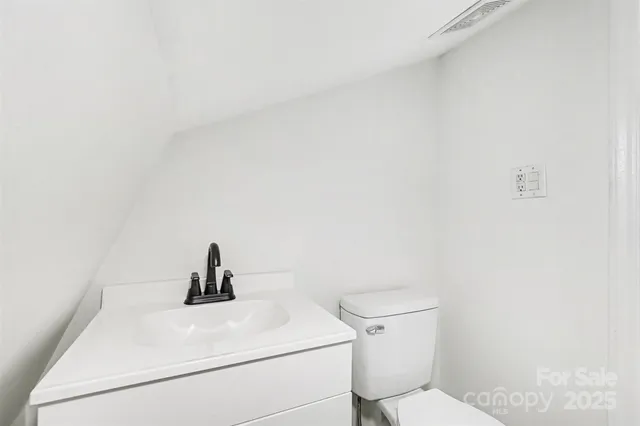 a bathroom with a toilet and sink