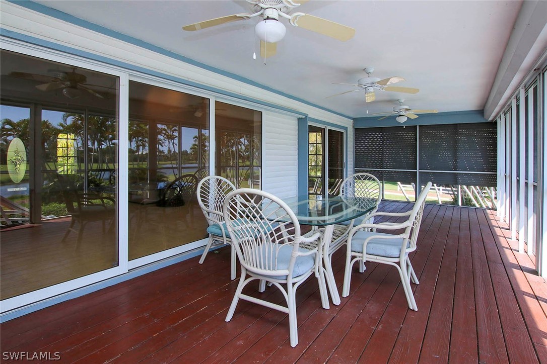 1573 Sand Castle Road Sanibel, FL 33957 - Photo 11 of 31 a view of a dining room with furniture and wooden floor