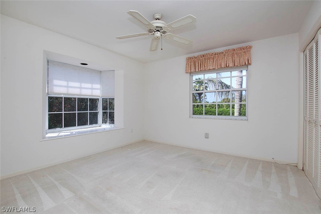 1573 Sand Castle Road Sanibel, FL 33957 - Photo 24 of 31 an empty room with windows and closet