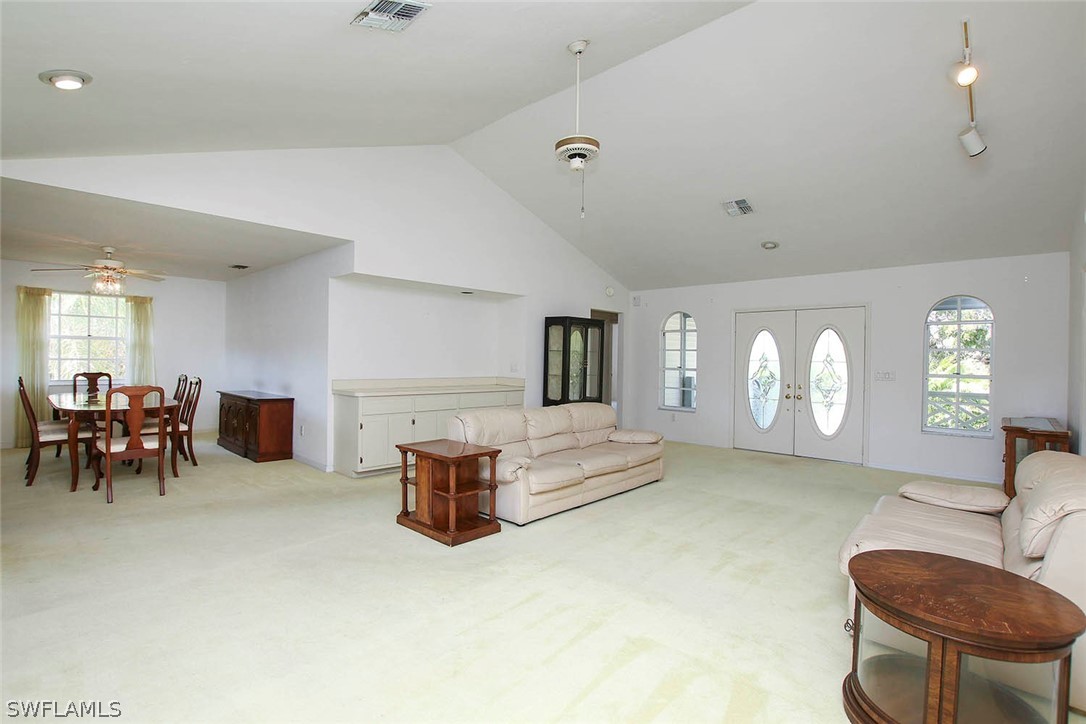 1573 Sand Castle Road Sanibel, FL 33957 - Photo 26 of 31 a living room with furniture and a table