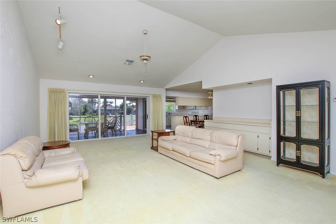 1573 Sand Castle Road Sanibel, FL 33957 - Photo 28 of 31 a spacious bedroom with a large bed and a large window