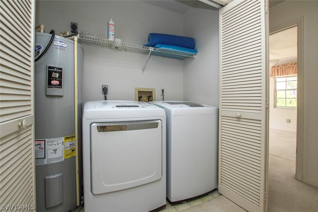 1573 Sand Castle Road Sanibel, FL 33957 - Photo 29 of 31 a utility room with dryer and washer