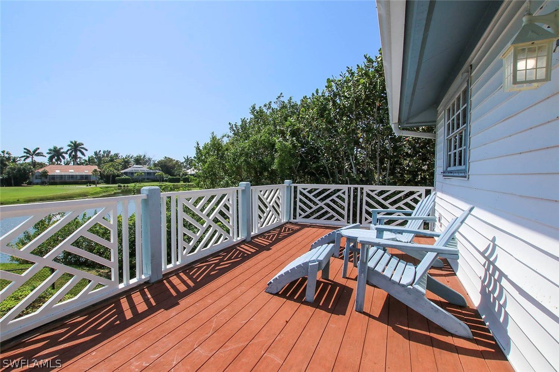 1573 Sand Castle Road Sanibel, FL 33957 - Photo 8 of 31 a view of a roof deck with couches and wooden floor