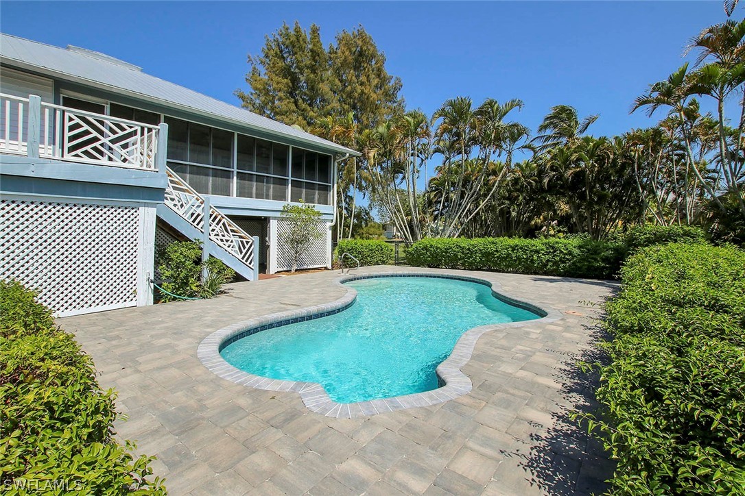 1573 Sand Castle Road Sanibel, FL 33957 - Photo 9 of 31 a view of outdoor space yard and front view of a house