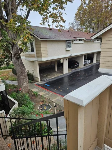 a view of street with parked cars
