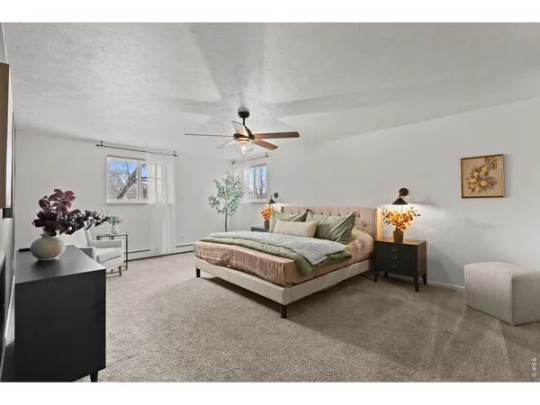 a bedroom with a bed and a chair