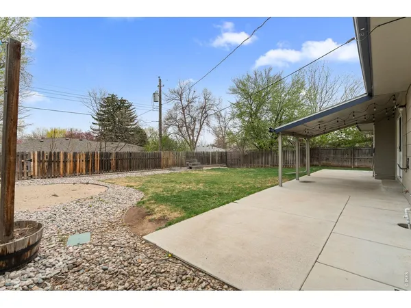 a patio with a yard