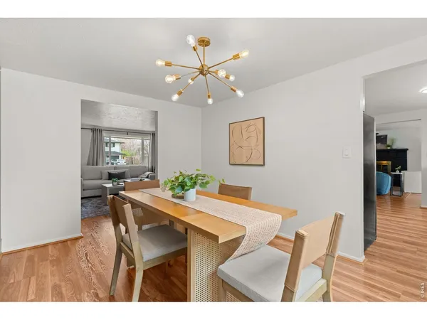 a kitchen with stainless steel appliances granite countertop a refrigerator a stove top oven a sink and dishwasher