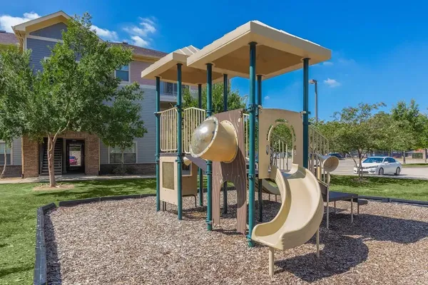 a patio with a yard table and chairs