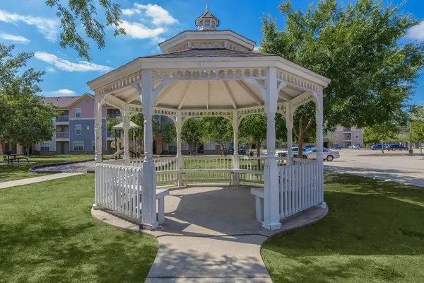 a view of a house with backyard and porch