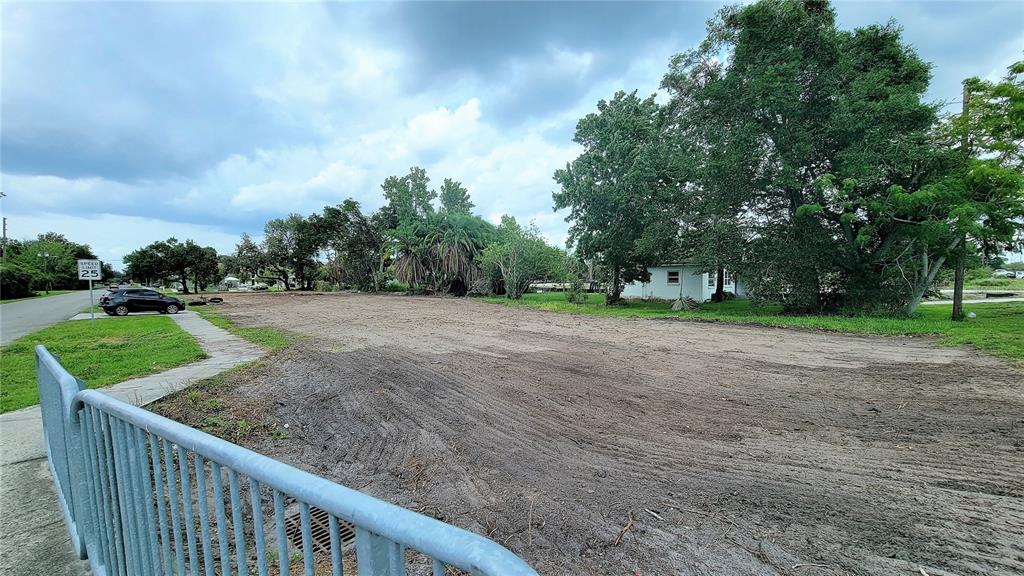 207 East Lancaster Road Orlando, FL 32809 - Photo 2 of 4 a view of a street with a yard