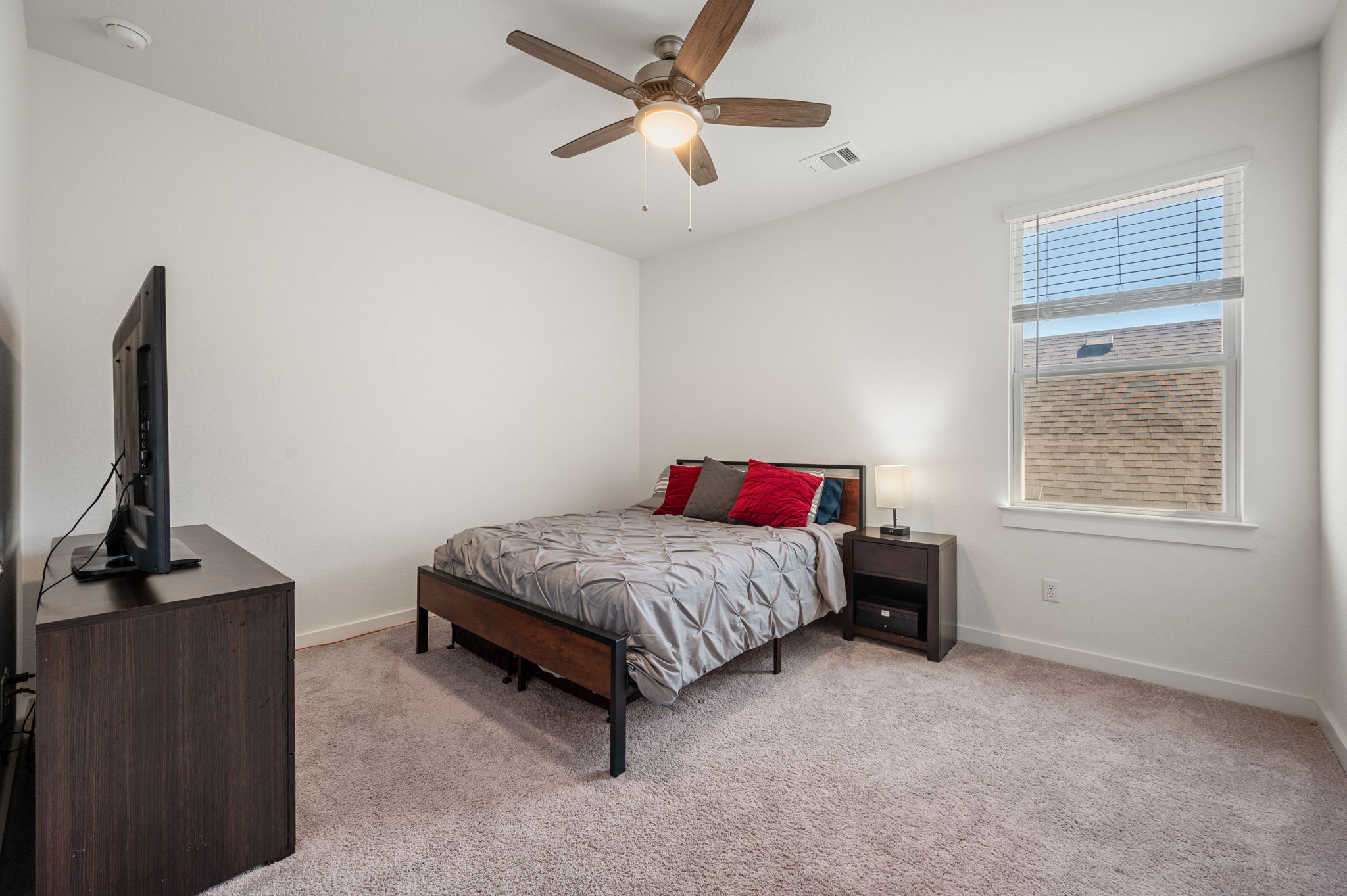 256 Comfort Maple Lane Dripping Springs, TX 78620 - Photo 25 of 39 Bedroom 4 - All bedrooms are complete with walk-in closets.