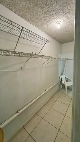 a view of a room with racks on the wall