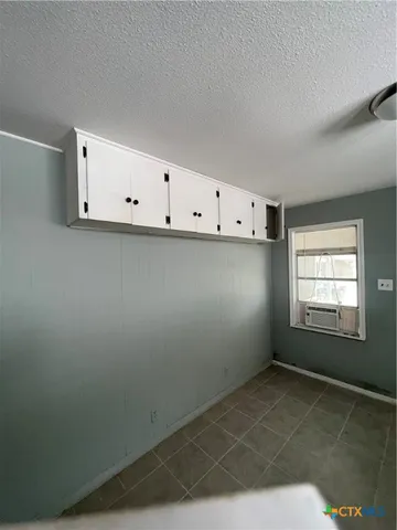 an empty room with cabinet
