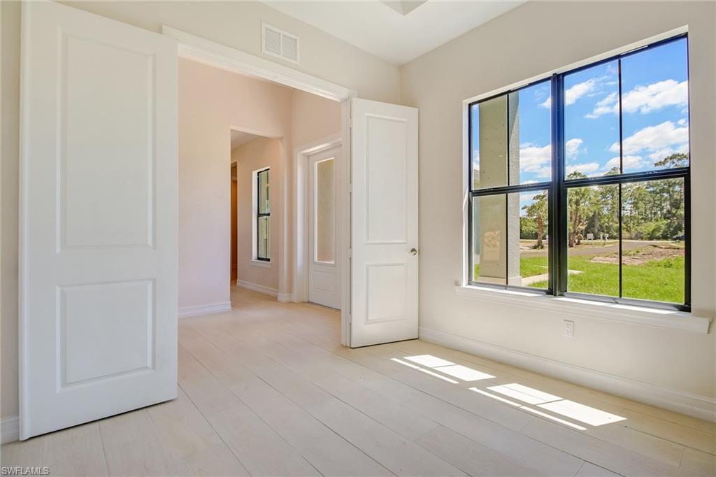 873 18th Street Northeast Naples, FL 34120 - Photo 11 of 25 a view of an empty room with a window