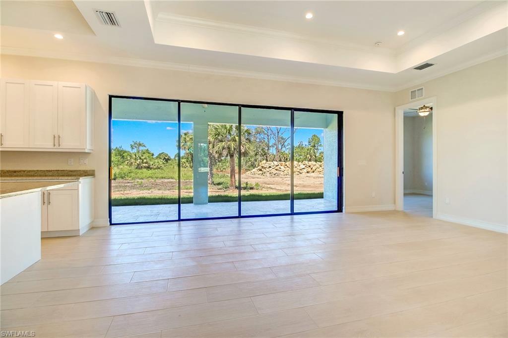 873 18th Street Northeast Naples, FL 34120 - Photo 4 of 25 a view of an entryway with wooden floor