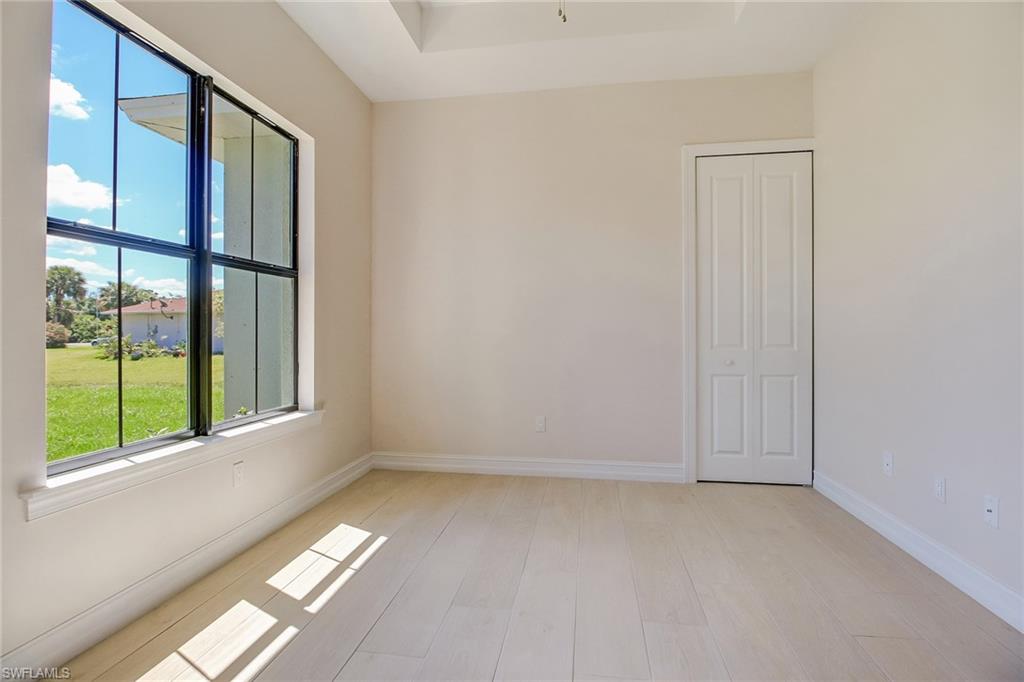 873 18th Street Northeast Naples, FL 34120 - Photo 10 of 25 an empty room with windows
