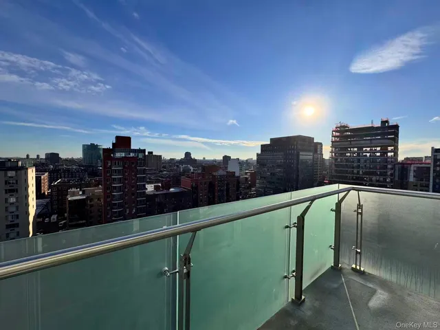 a view of a balcony and an outdoor seating