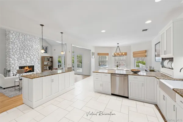 a large kitchen with a stove a sink and a refrigerator