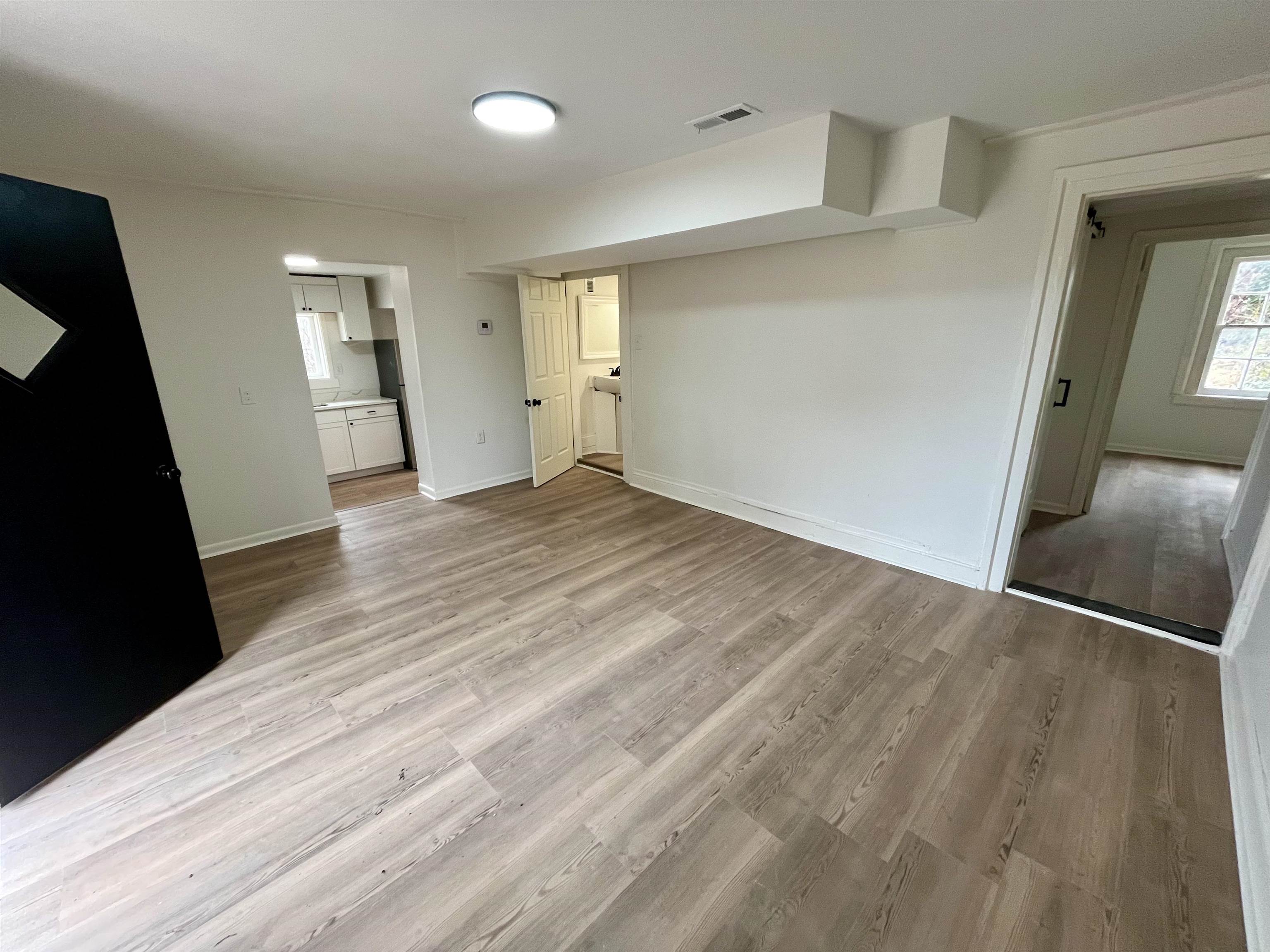 500 Ridge Street, Unit B Charlottesville, VA 22902 - Photo 13 of 13 wooden floor in an empty room with a mirror
